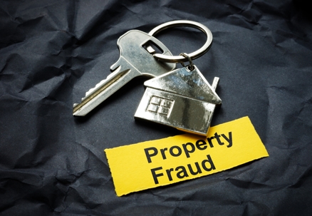 Key and strip with inscription property fraud. stock photo